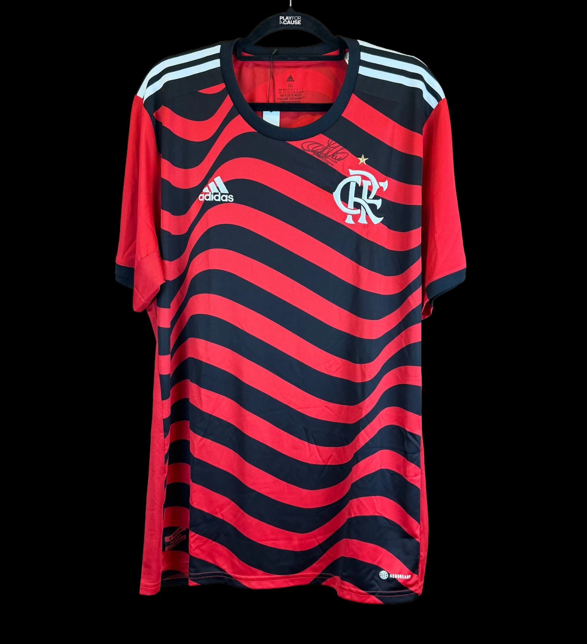 announcements/367f5497-cc20-4456-82e9-4bb43bbbc53f/1786466235704-camisa-flamengo-adilio-autografada-1.webp