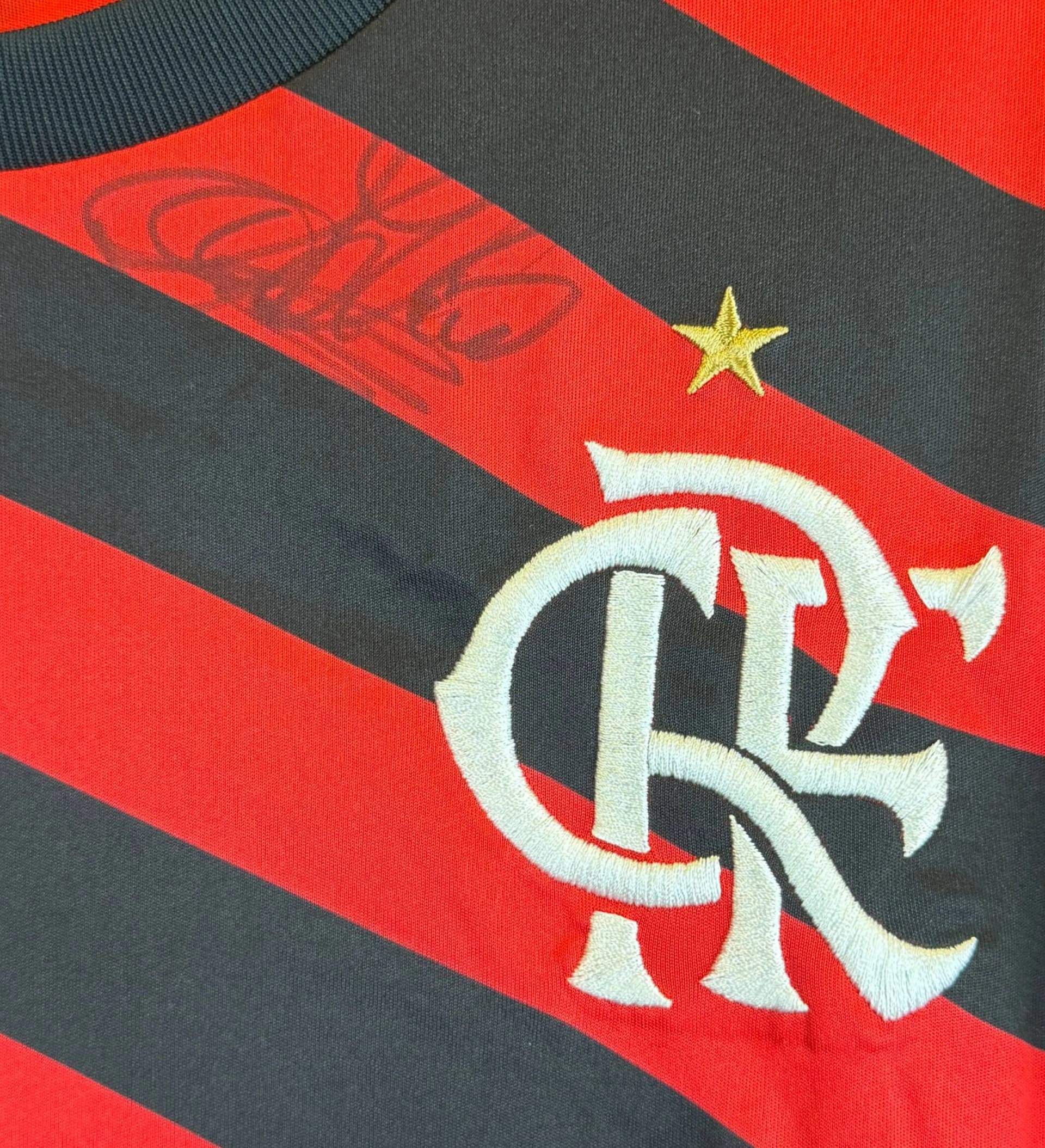 announcements/367f5497-cc20-4456-82e9-4bb43bbbc53f/1786466235864-camisa-flamengo-adilio-autografada-3.webp