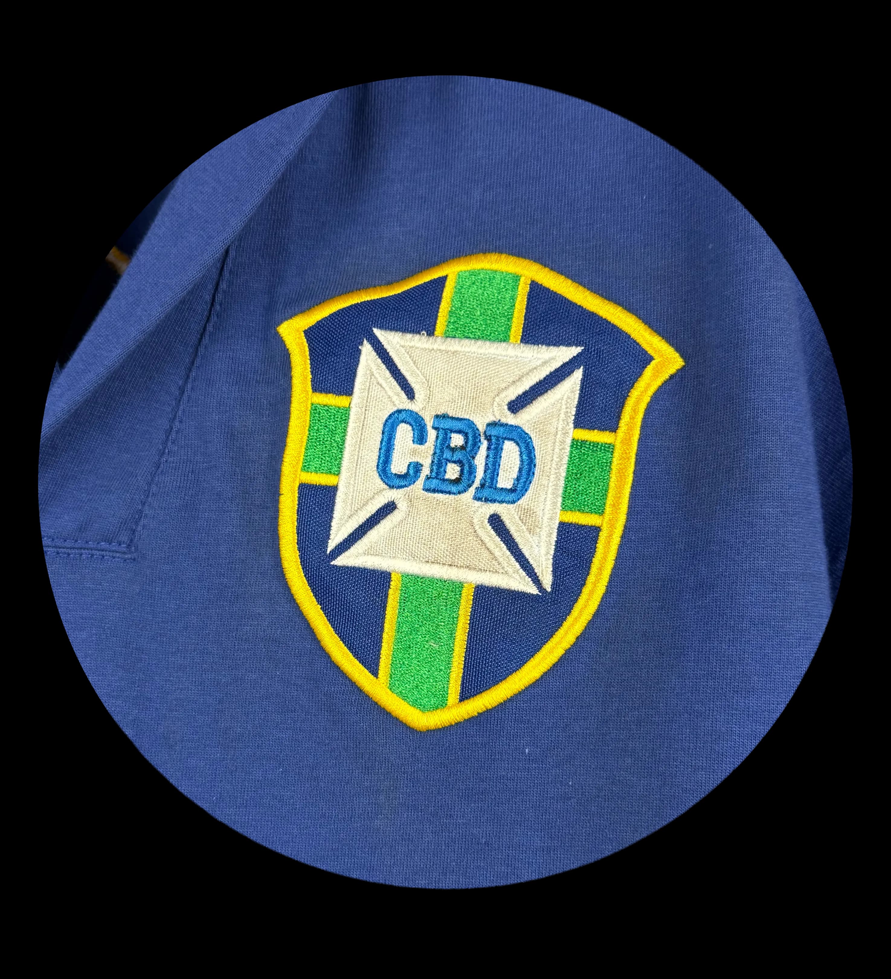 announcements/98ee9297-8155-442e-9529-d17be0b3378e/1785343737995-camisa-brasil-azul-escudo.webp